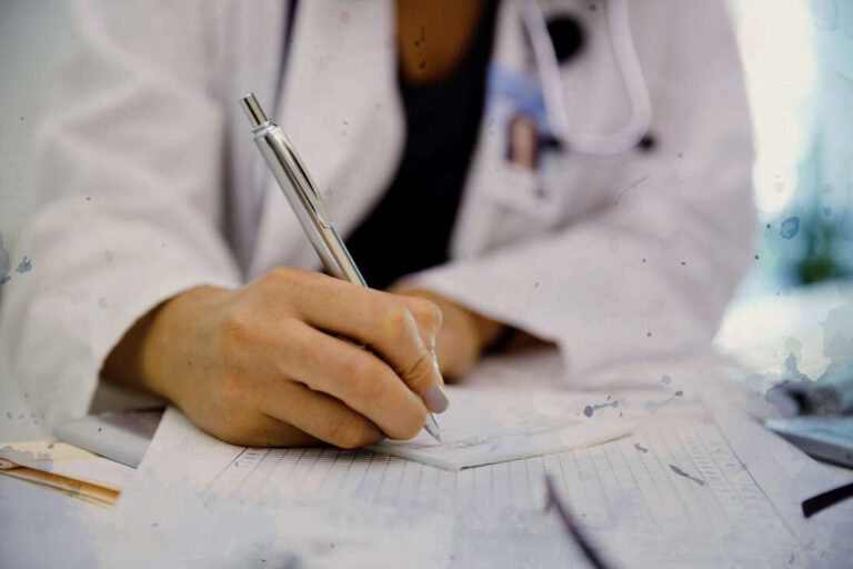 Female doctor writing prescription